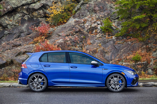 2022 Volkswagen Golf R, blue, in front of rock wall, nature